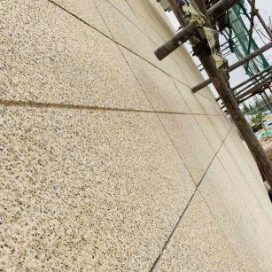 葫芦岛 黄金麻花岗岩荔枝面外墙干挂石材效果示例