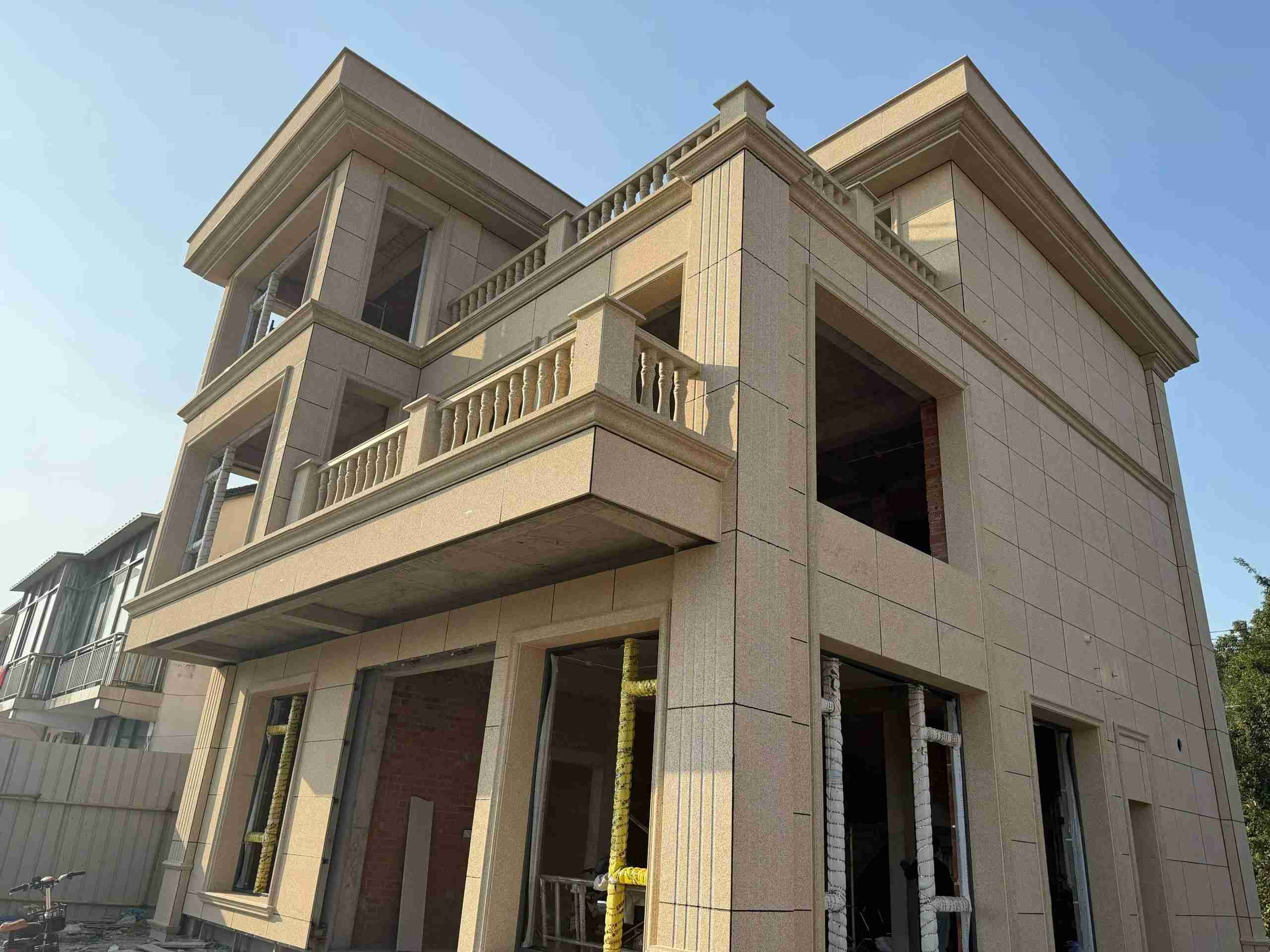 葫芦岛 黄金麻花岗岩石材荔枝面外墙干挂效果展示