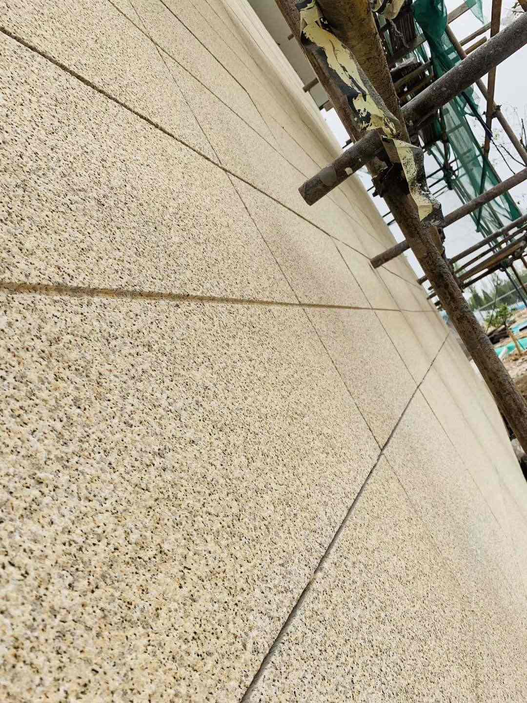 葫芦岛 黄金麻花岗岩荔枝面外墙干挂石材效果示例